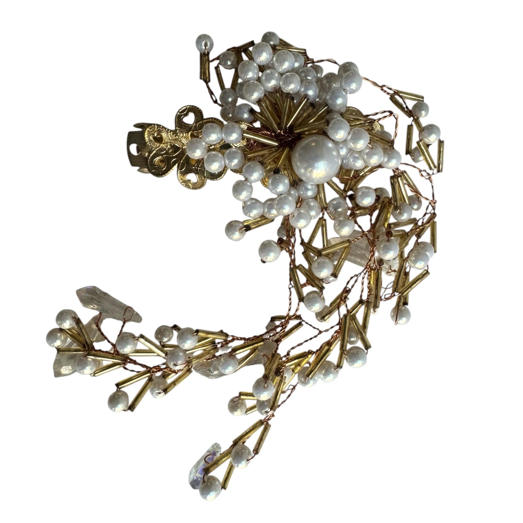 A vintage-style gold-toned headpiece or hair accessory decorated with clusters of white faux pearls and small clear rhinestones, shown on a plain white background.